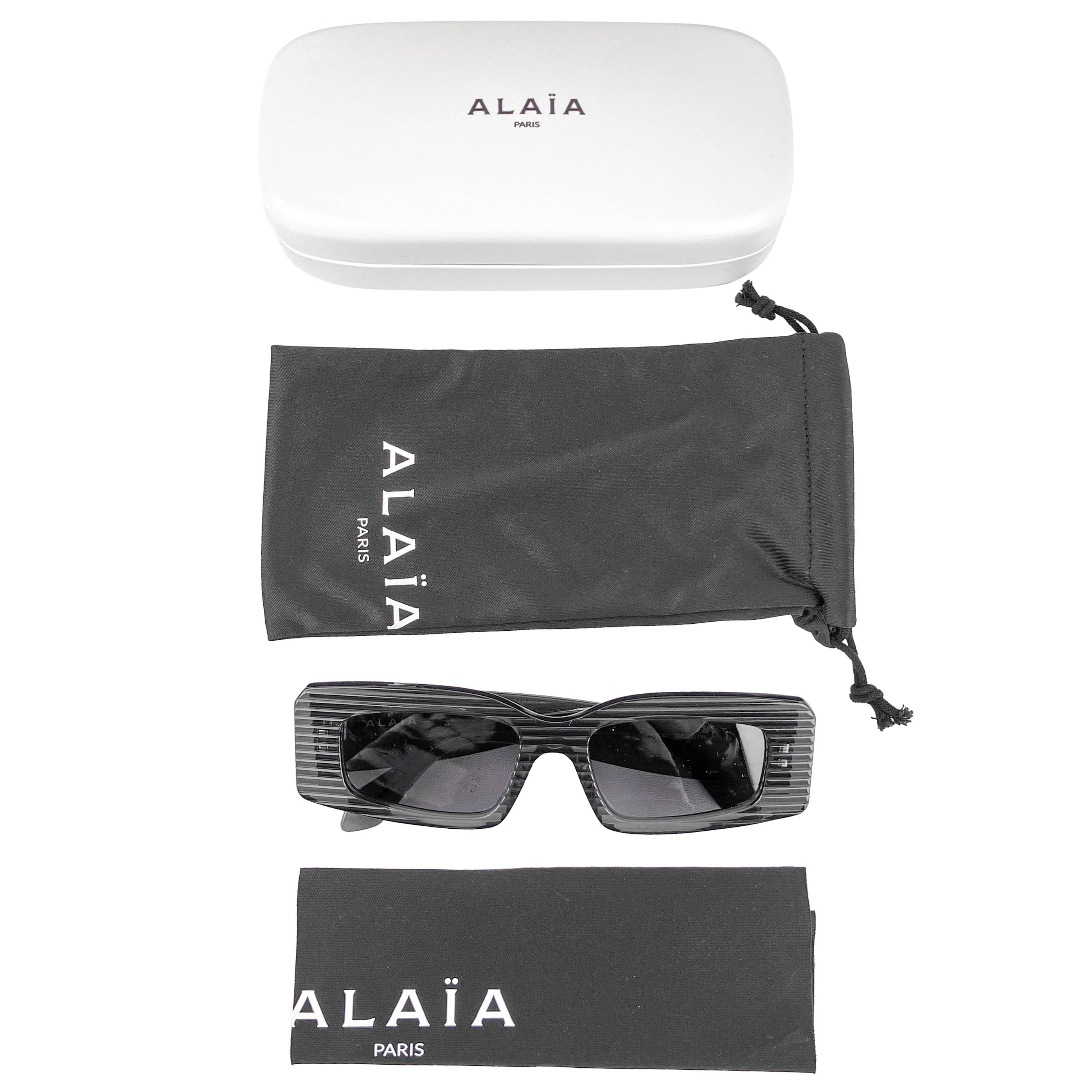 Alaïa Ribbed Rectangle Sunglasses in Black - Image 6